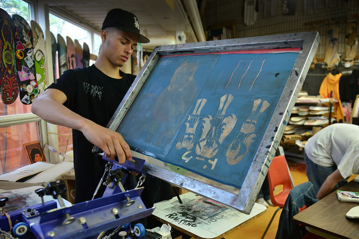 Photo of student screen printing